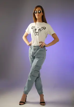 Laura modeling a white t-shirt featuring the DandiLion logo from The Honest Whisper, a brand known for its ethical and sustainable fashion.