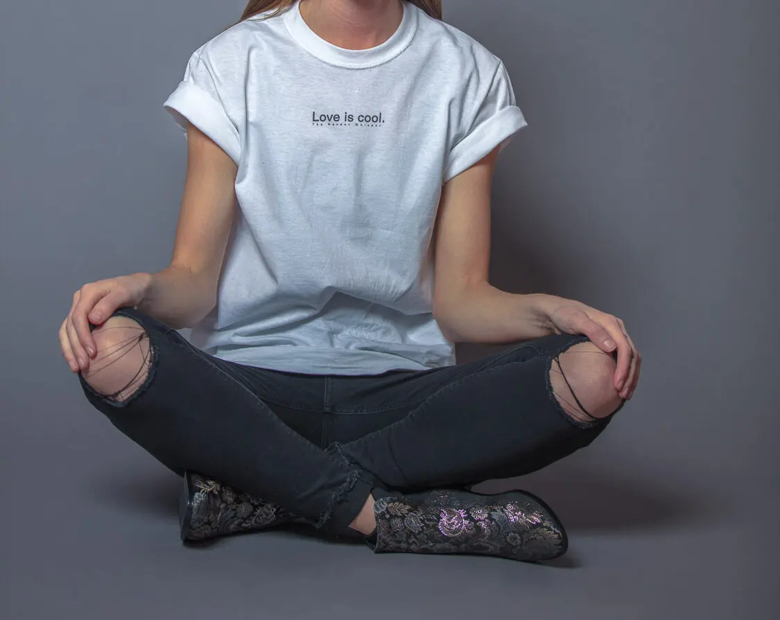 A woman wearing a t-shirt with the message 