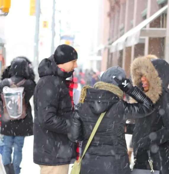A group of animal rights activists, with one person wearing gloves from The Honest Whisper.