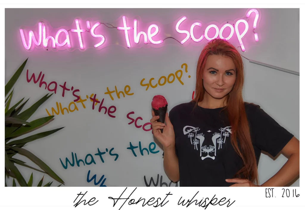 The logo for The Honest Whisper, a vegan lifestyle brand and blog, on a shirt, featuring the phrase 